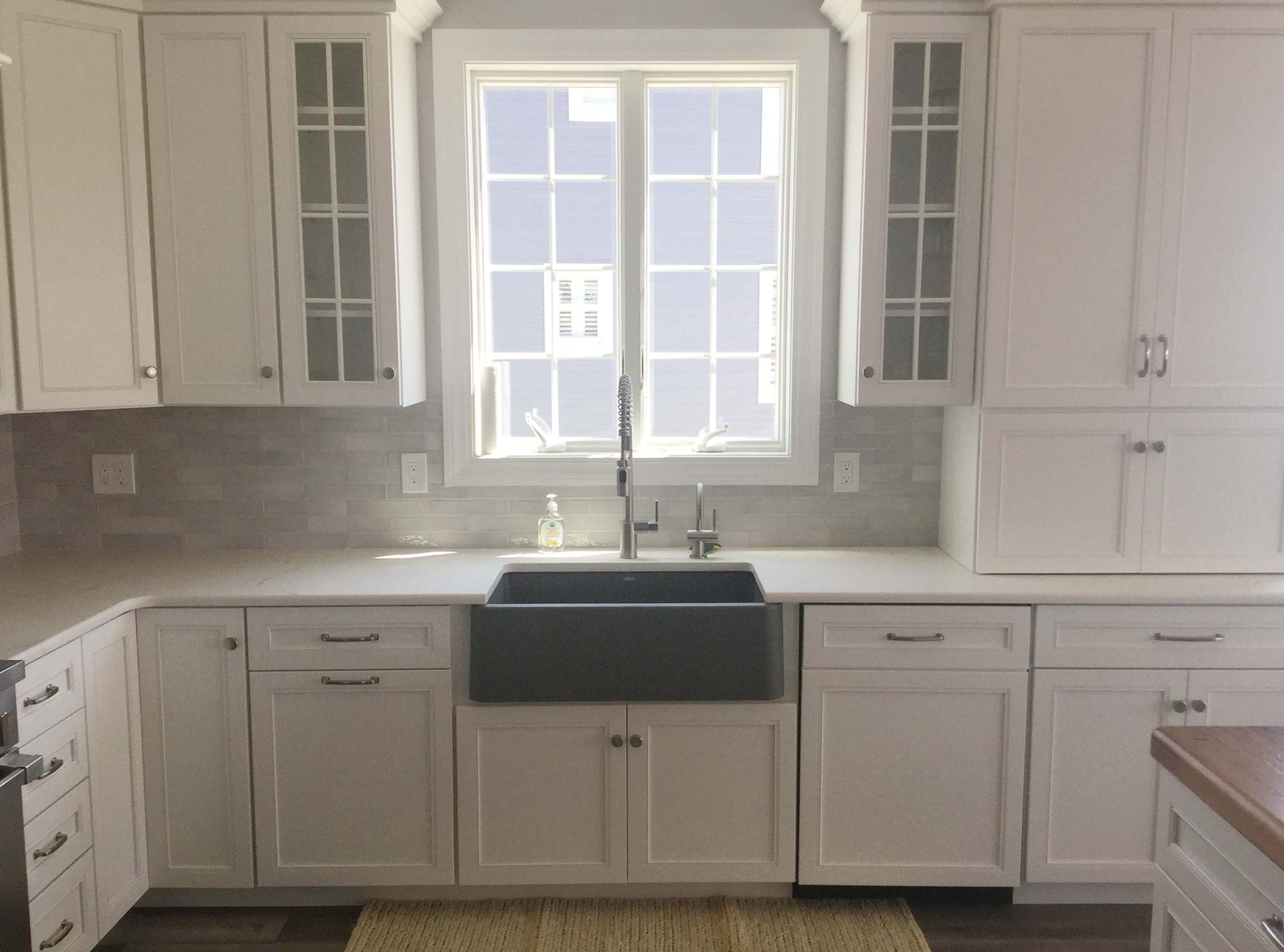White custom cabinets and window